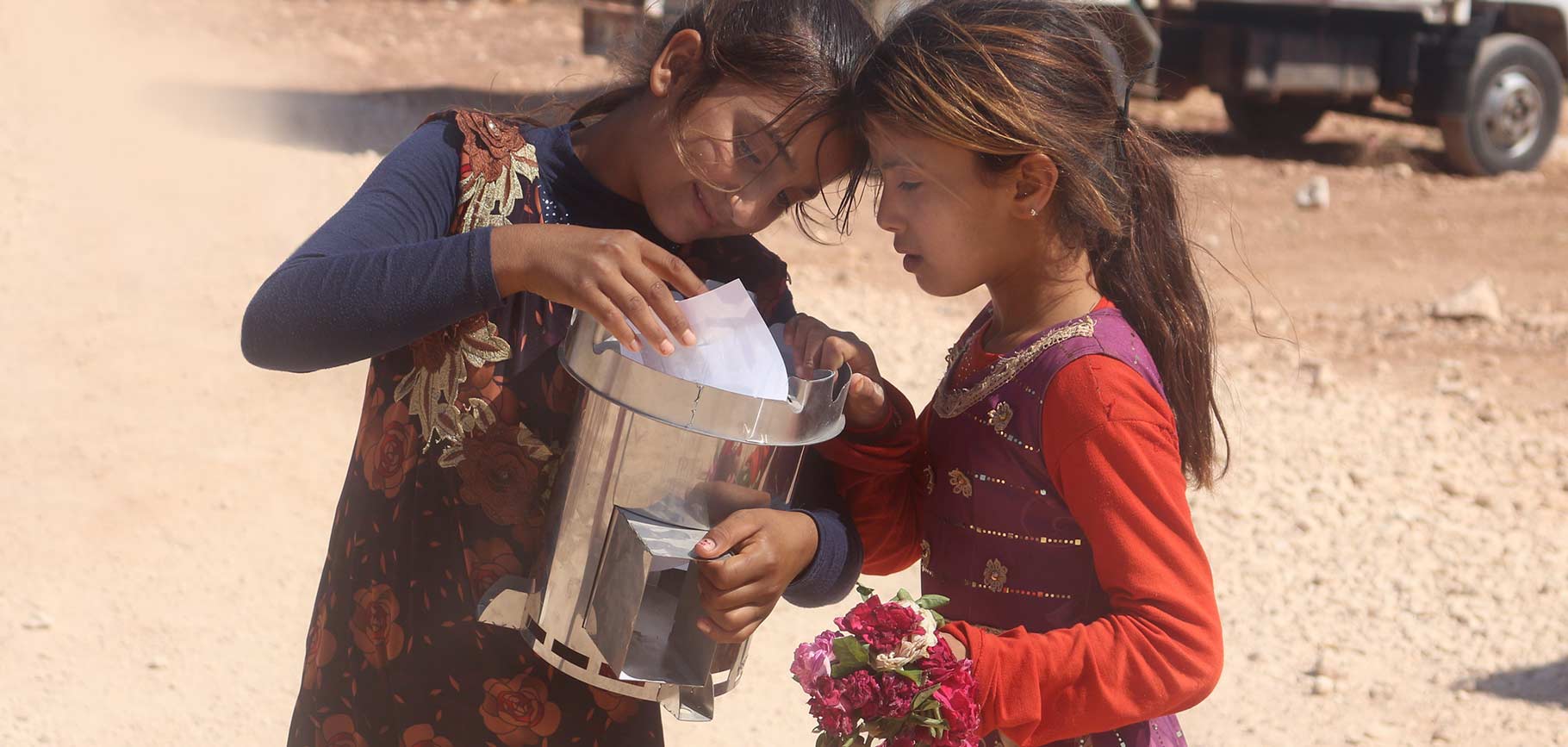 Syrian girls with Fire for Life stove from Escea