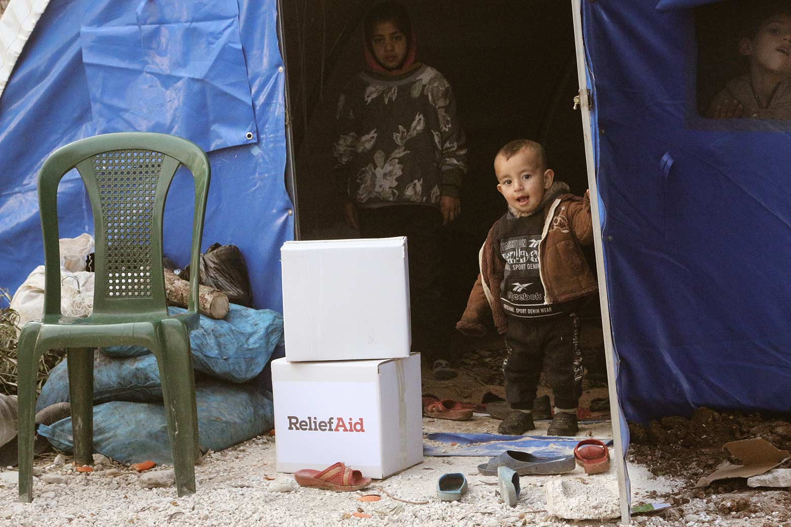 Families, now displaced by the earthquake, receiving aid